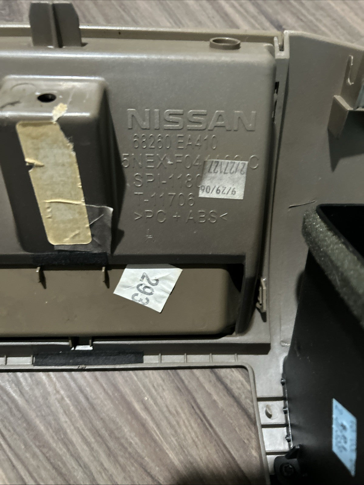 2005-2007 NISSAN PATHFINDER RADIO BEZEL DIGITAL TAN SILVER SURROUND TRIM DASH