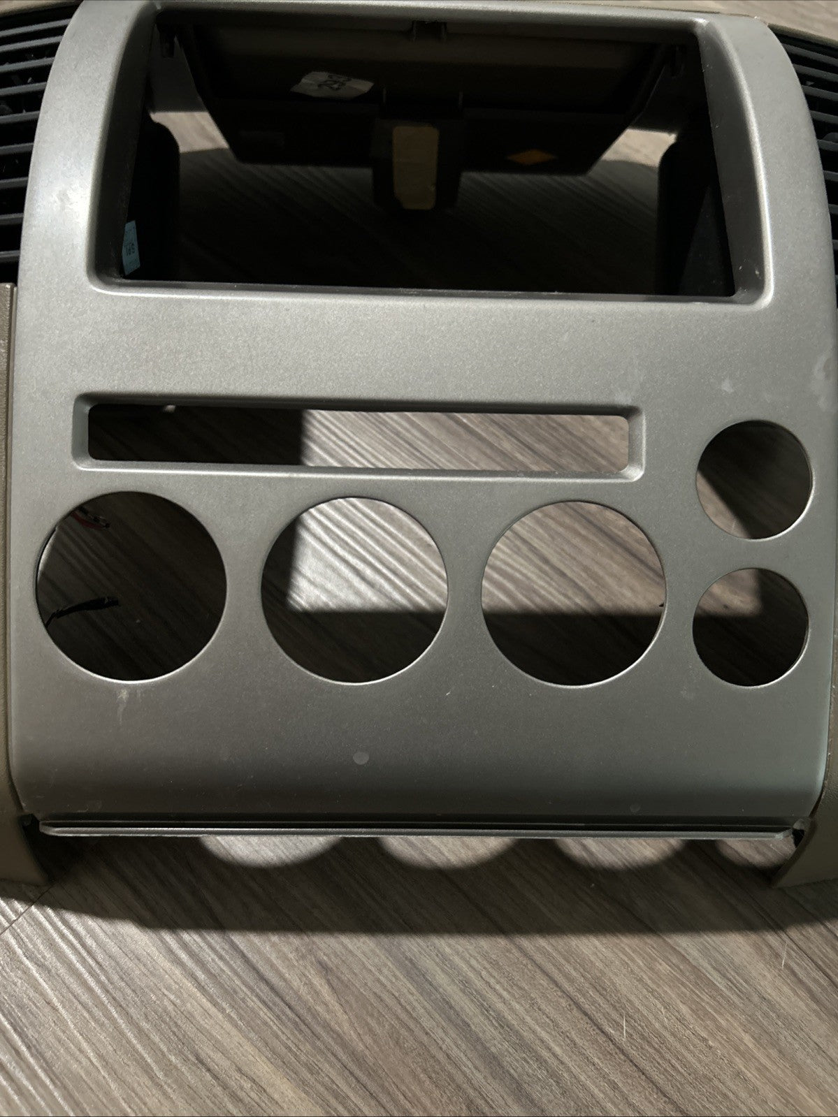 2005-2007 NISSAN PATHFINDER RADIO BEZEL DIGITAL TAN SILVER SURROUND TRIM DASH