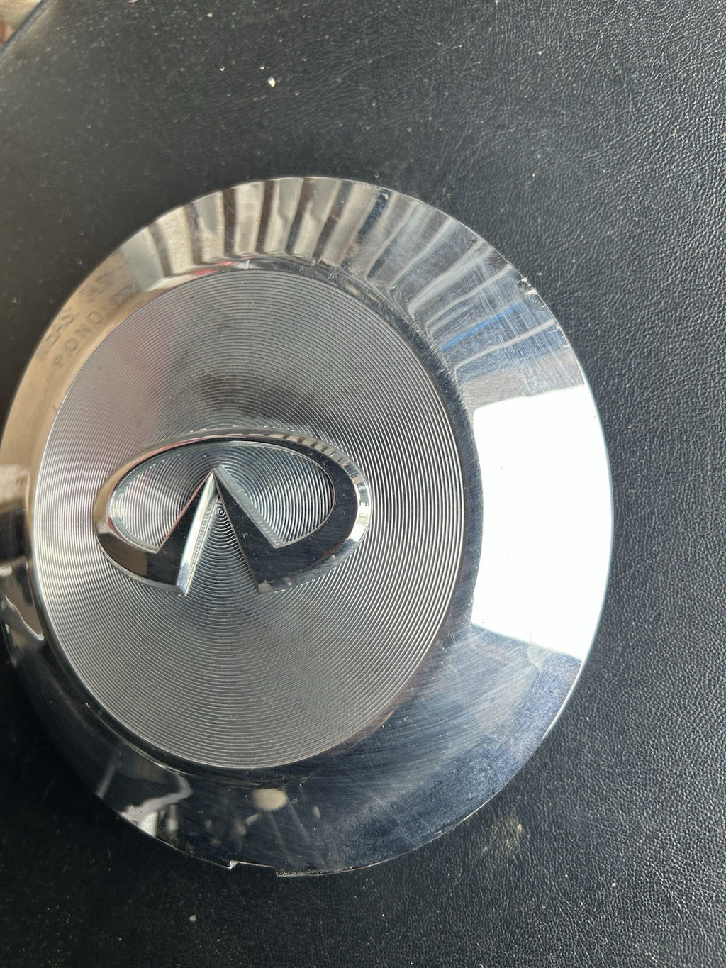 Infiniti QX56 center cap, chrome, 2004-2007 part number 40315 7S510 03