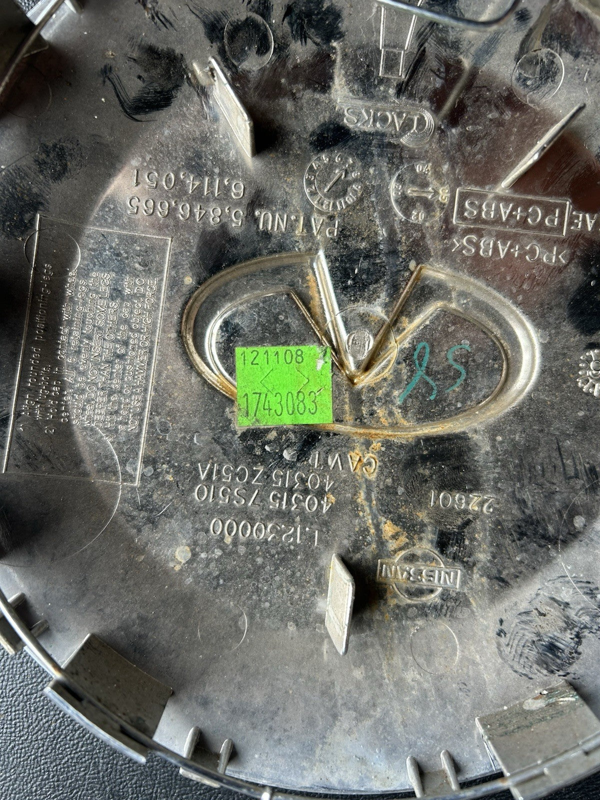 Infiniti QX56 center cap, chrome, 2004-2007 part number 40315 7S510 03